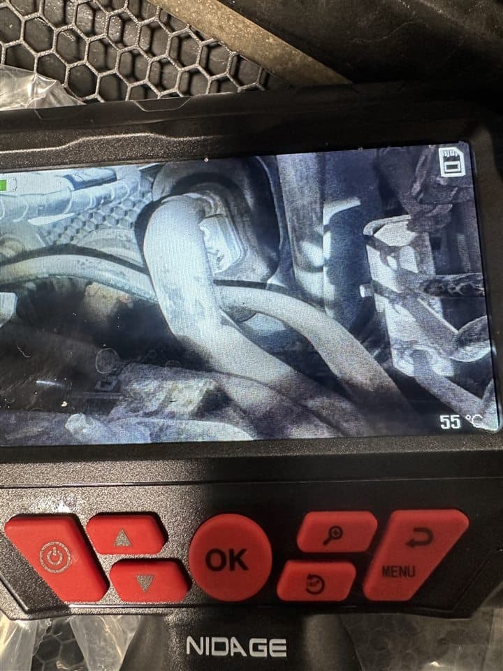 Borescope camera inspecting a hard-to-reach vehicle component