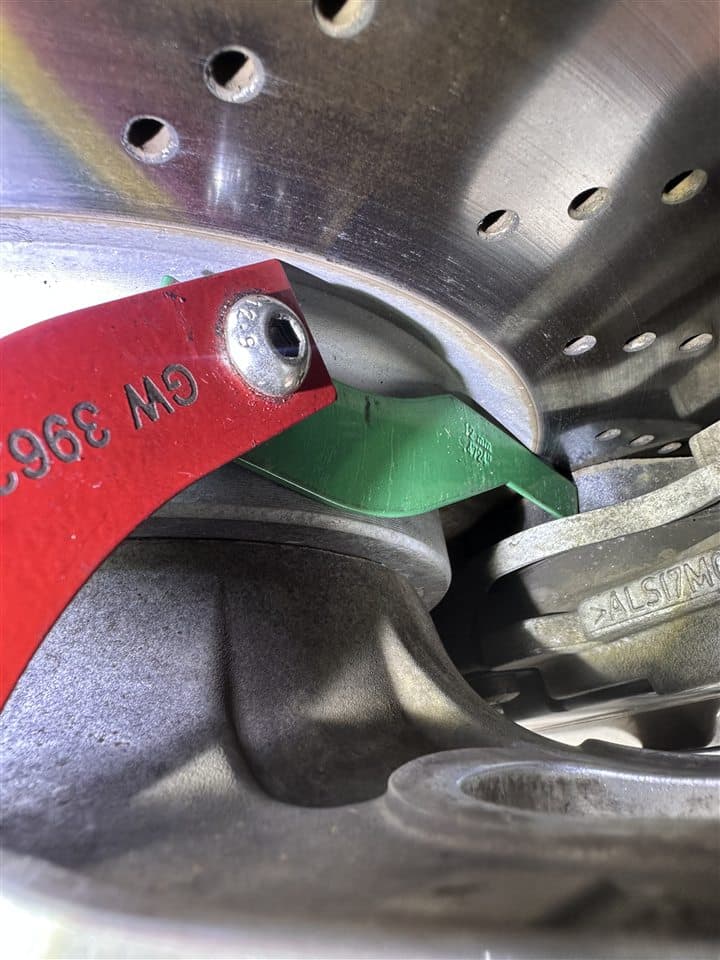 Brake component being measured during an inspection